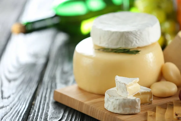 Board with variety of cheese — Stock Photo, Image