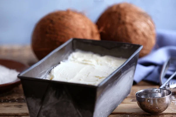Black container with coconut ice cream Stock Picture