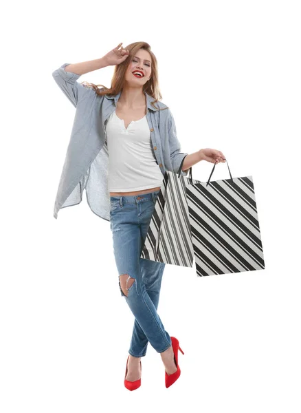 Beautiful young woman with paper bags — Stock Photo, Image