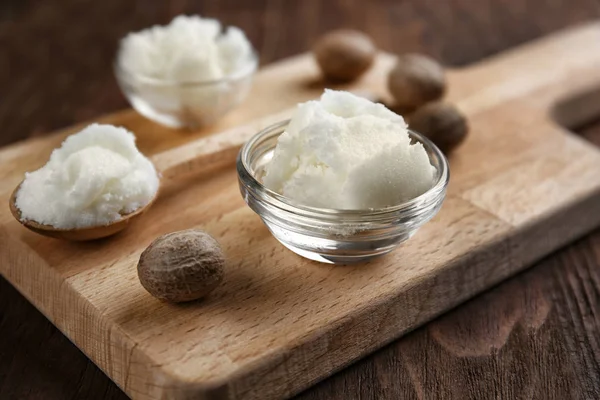 Shea butter in bowl and spoon — Stock Photo, Image