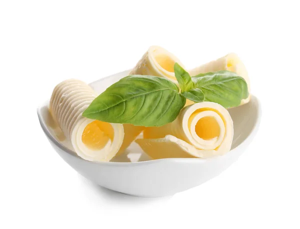 Delicious butter curls with basil — Stock Photo, Image