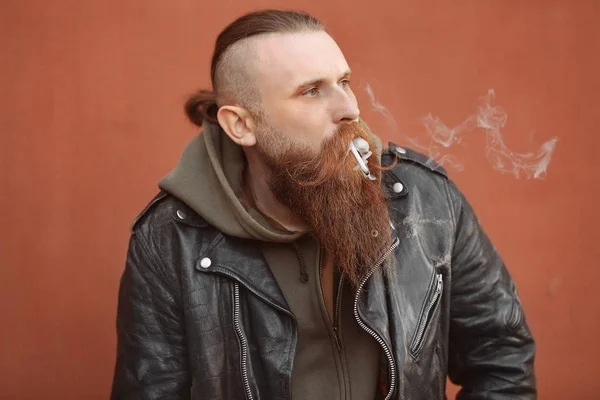 Bearded man smoking weed