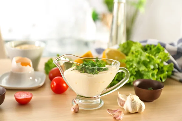 Delicious mayonnaise in gravy boat — Stock Photo, Image