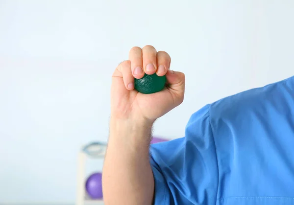 Man doing exercises with stress ball — Stock Photo, Image