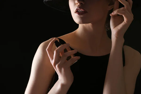 Young woman with bottle of perfume — Stock Photo, Image