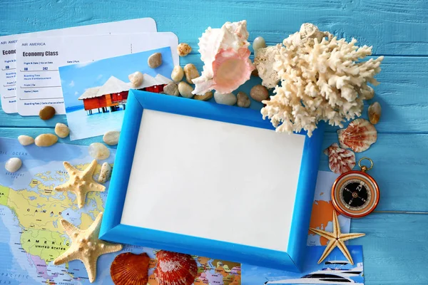 Travel concept. Composition with photo frame on wooden background — Stock Photo, Image