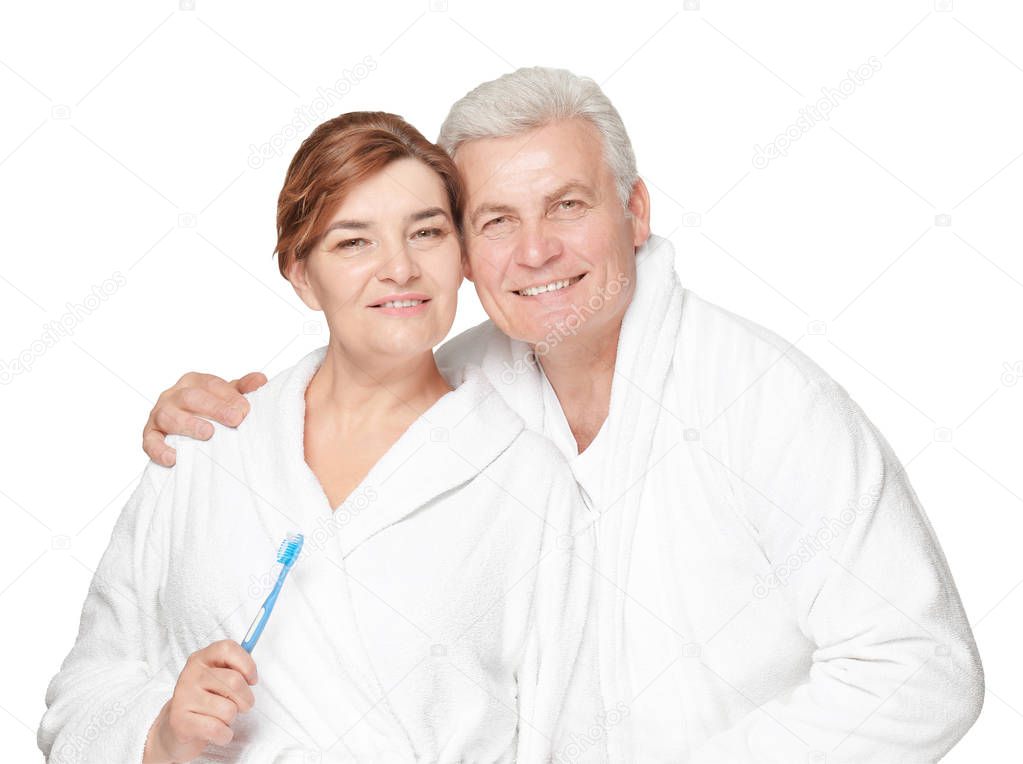Senior woman with toothbrush and husband