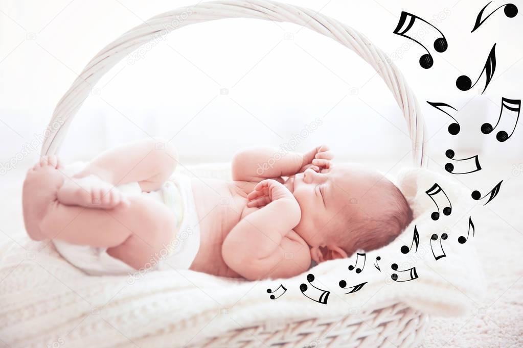 Cute baby sleeping in basket. Lullaby songs and music concept