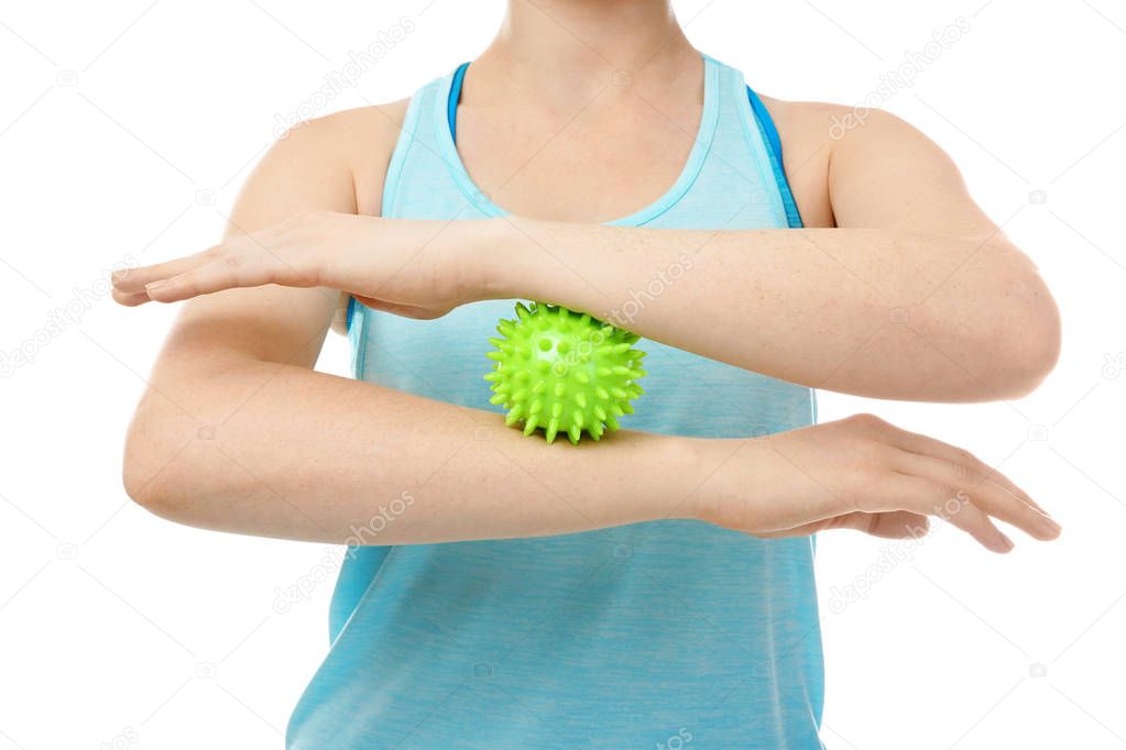 Woman doing exercises with rubber ball 