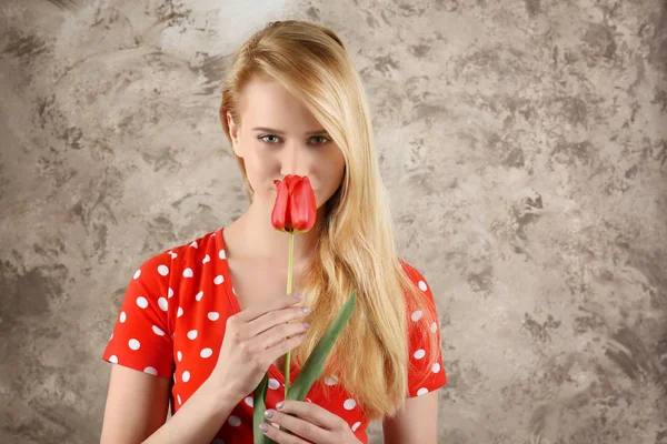 Young woman with tulip — Stock Photo, Image