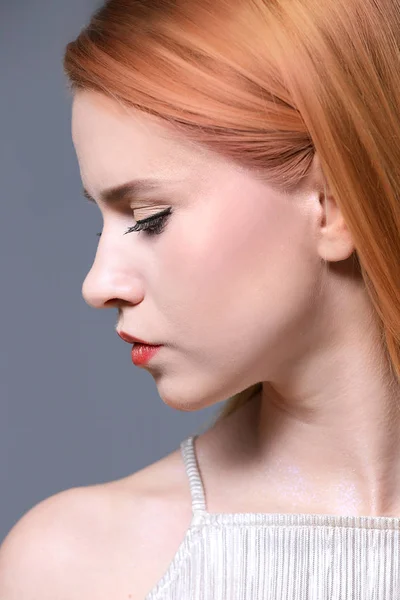 Young woman with strawberry blonde hair