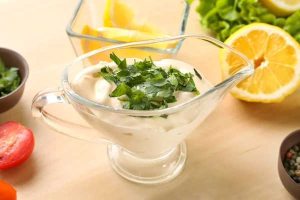 Delicious mayonnaise in gravy boat — Stock Photo, Image