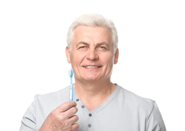 Starší muž s zubní kartáček — Stock fotografie