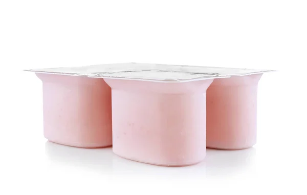 Plastic cups with yogurt — Stock Photo, Image
