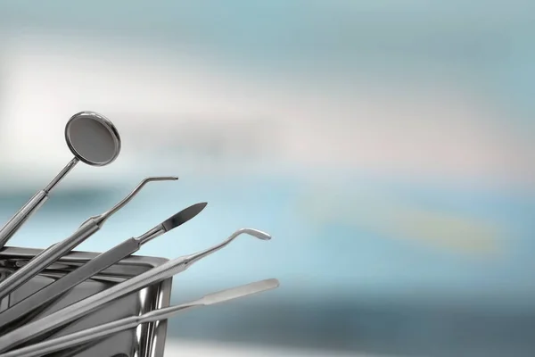 Dental tools on blurred background — Stock Photo, Image