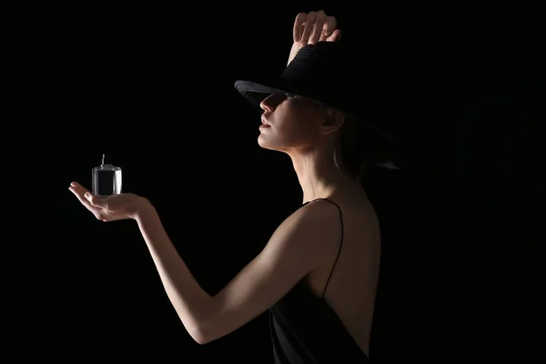 Young woman with bottle of perfume — Stock Photo, Image