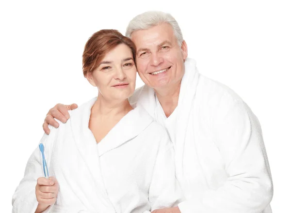 Senior woman with toothbrush and husband — Stock Photo, Image