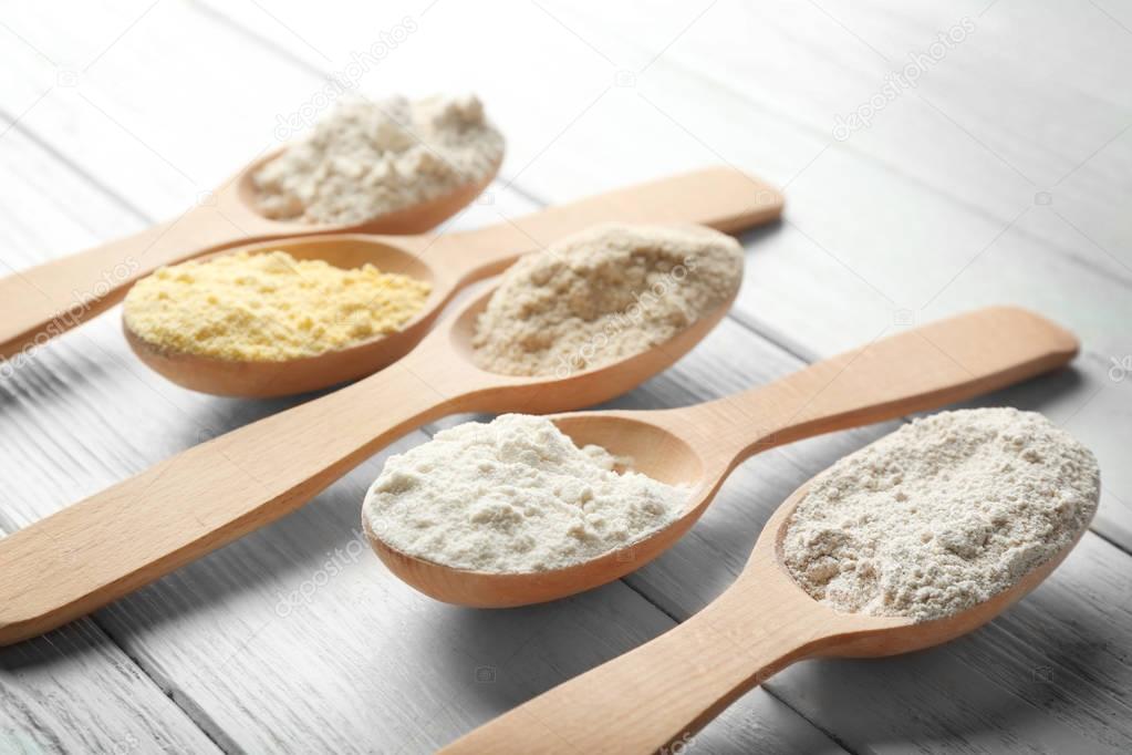 Spoons with different types of flour 