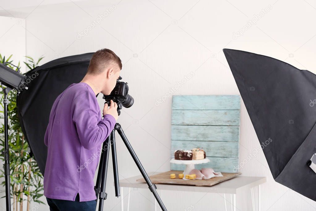 man photographing food