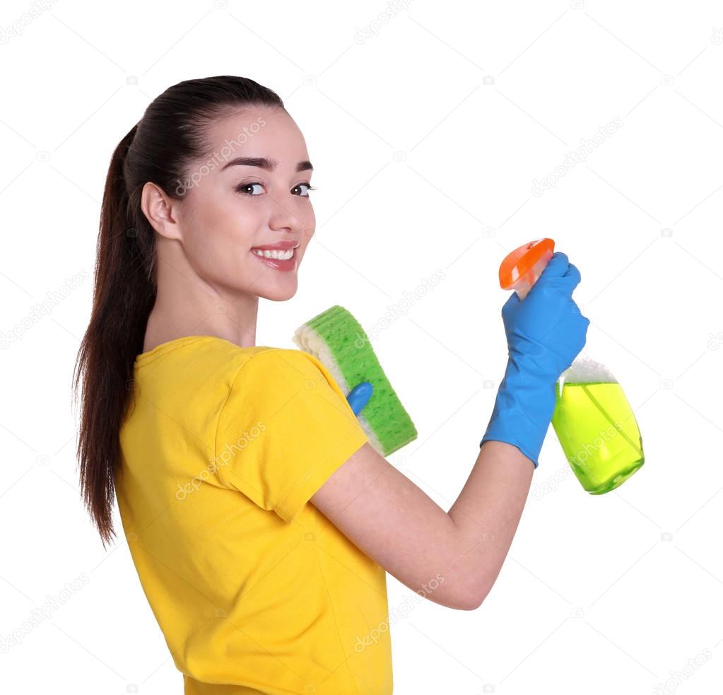 woman holding sponge and cleanser spray 