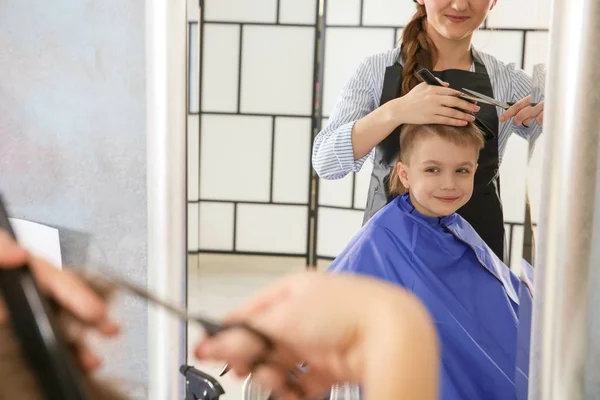 Boy in hairdressing salon Royalty Free Stock Photos