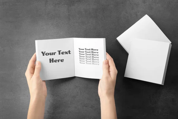 Woman holding blank notebook with space for text — Stock Photo, Image