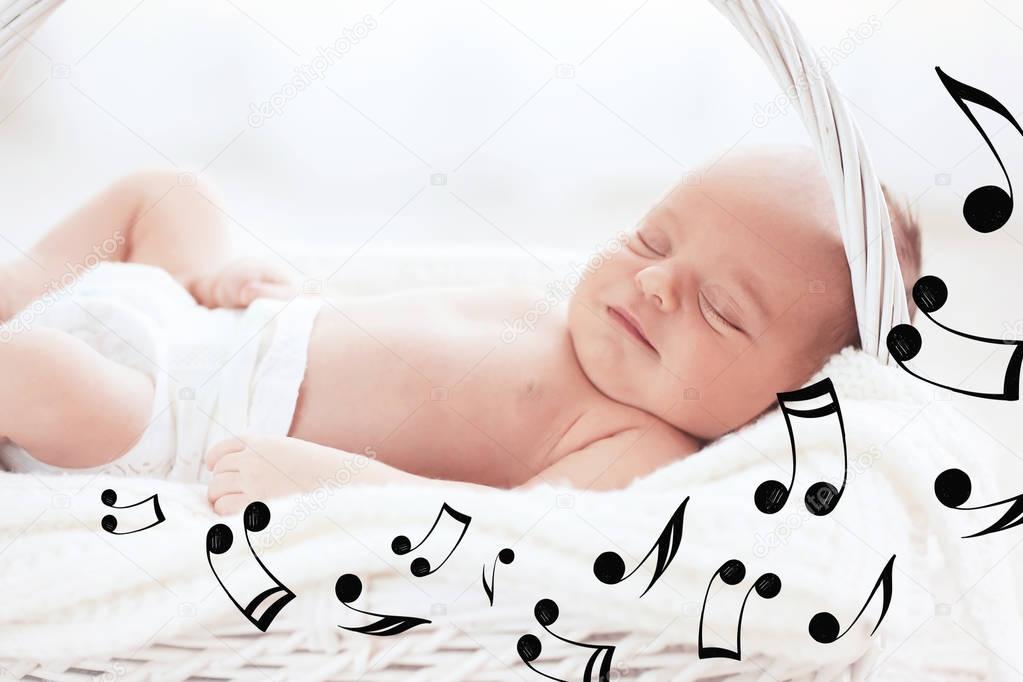 Cute baby sleeping in basket. Lullaby songs and music concept
