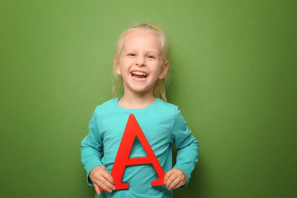 Cute little girl with letter A — Stock Photo, Image
