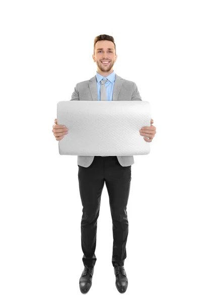 Young man with orthopedic pillow — Stock Photo, Image