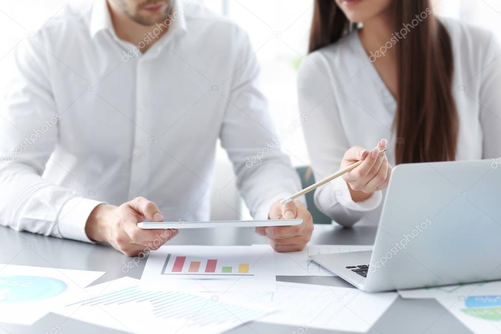 Business people working in office, closeup