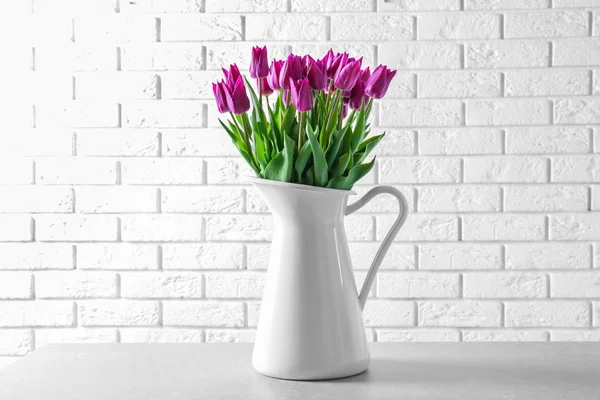 Jug with beautiful tulips — Stock Photo, Image