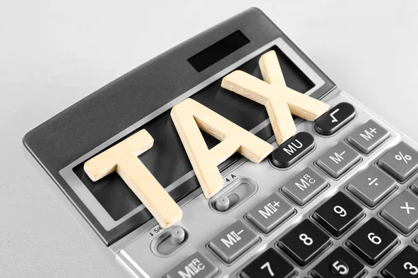 Word TAX and calculator — Stock Photo, Image