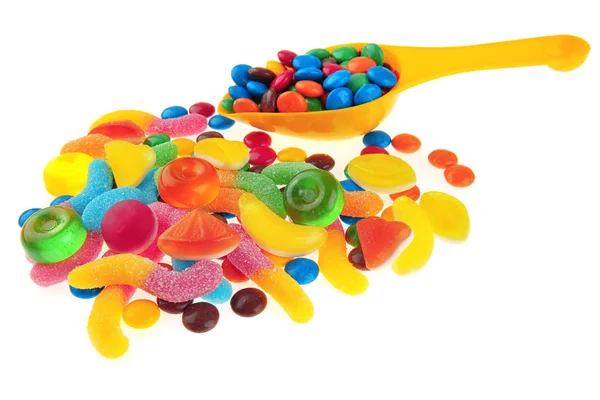 Tasty fruit candies and scoop — Stock Photo, Image