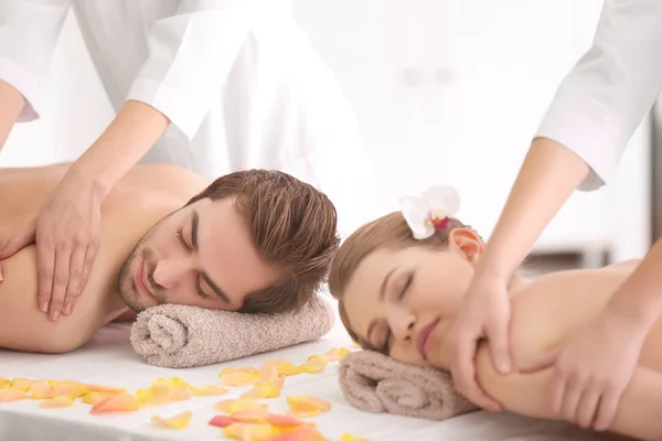 couple having massage in spa salon