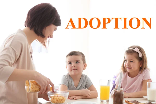 Adoption concept. Happy family having breakfast at home