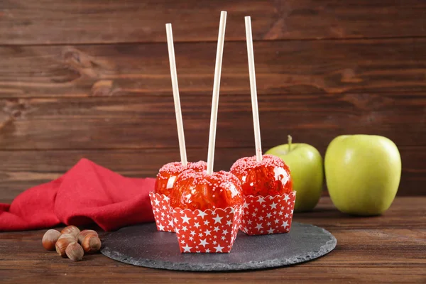 Slate plate with candy apples — Stock Photo, Image