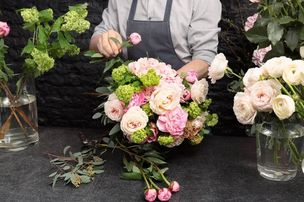 Florist making beautiful bouquet