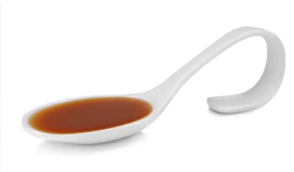 Spoon with delicious sauce — Stock Photo, Image