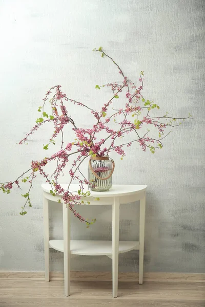 Vase with branches of blooming tree flowers — Stock Photo, Image