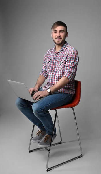 Young programmer using laptop — Stock Photo, Image