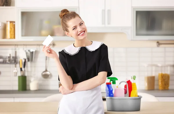 Young chambermaid with business card — Stock Photo, Image