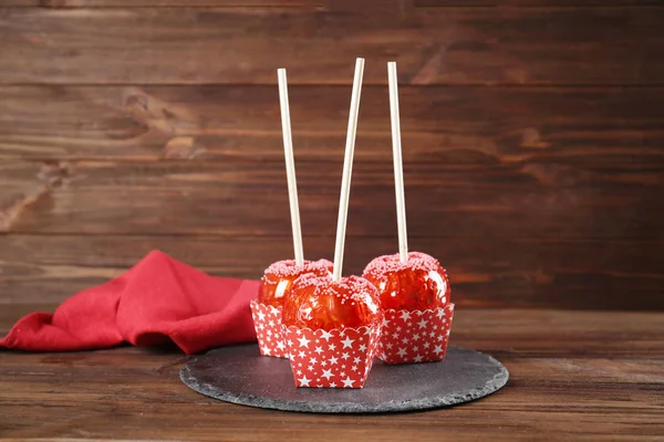 Slate plate with candy apples — Stock Photo, Image