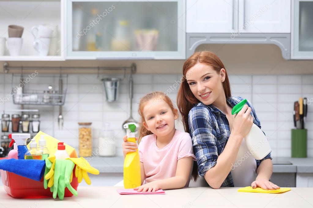 Little girl and her mother cleaning