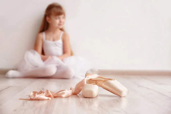 Ballet shoes and beautiful little ballerina — Stock Photo, Image