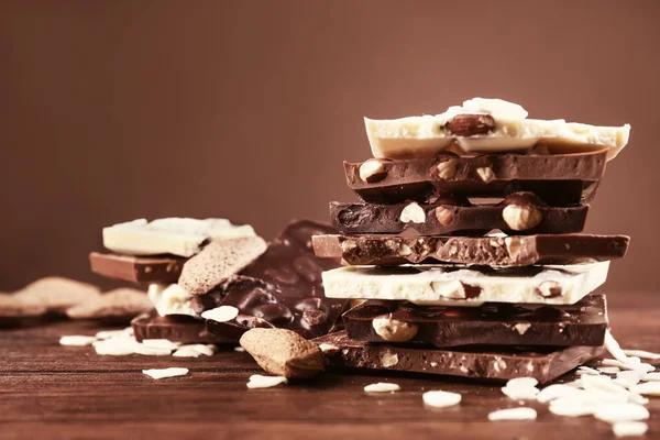 Milk, dark and white chocolate with almond nut — Stock Photo, Image