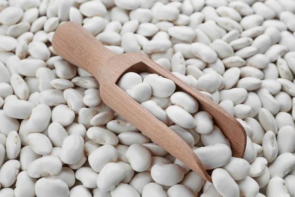 Wooden scoop with butter beans