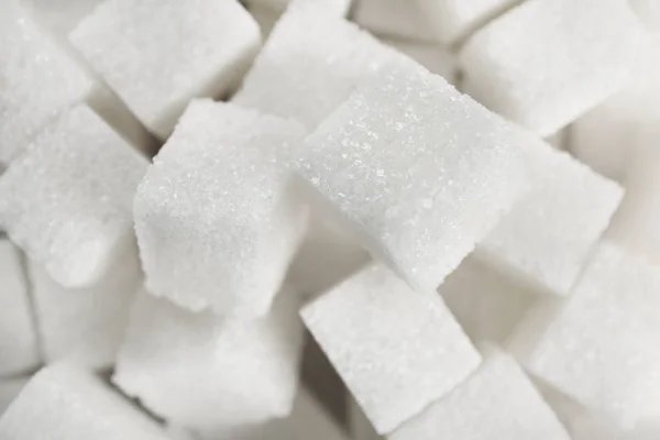 Sugar cubes as background — Stock Photo, Image