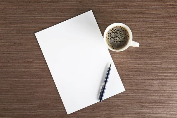 Paper sheet with pen and cup of coffee Stock Image