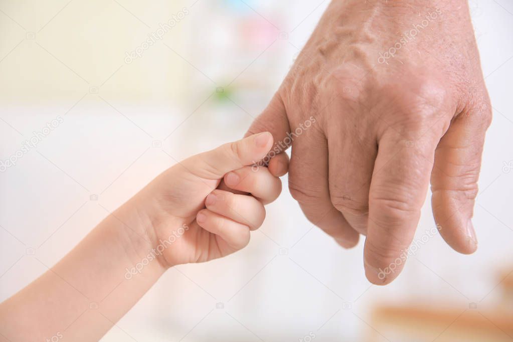 Senior  and  child holding hands