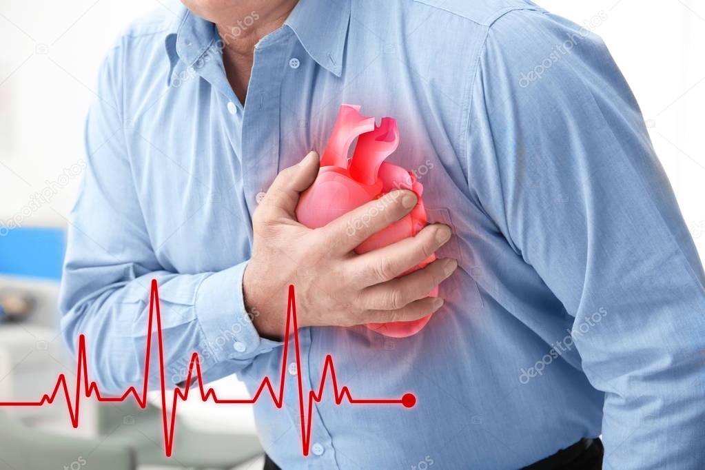 Senior man suffering from chest pain
